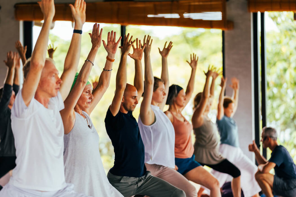 people practicing yoga and meditation for morning practice